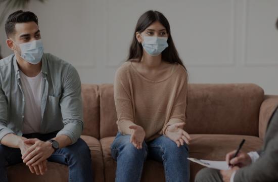 couple in divorce talks with masks on
